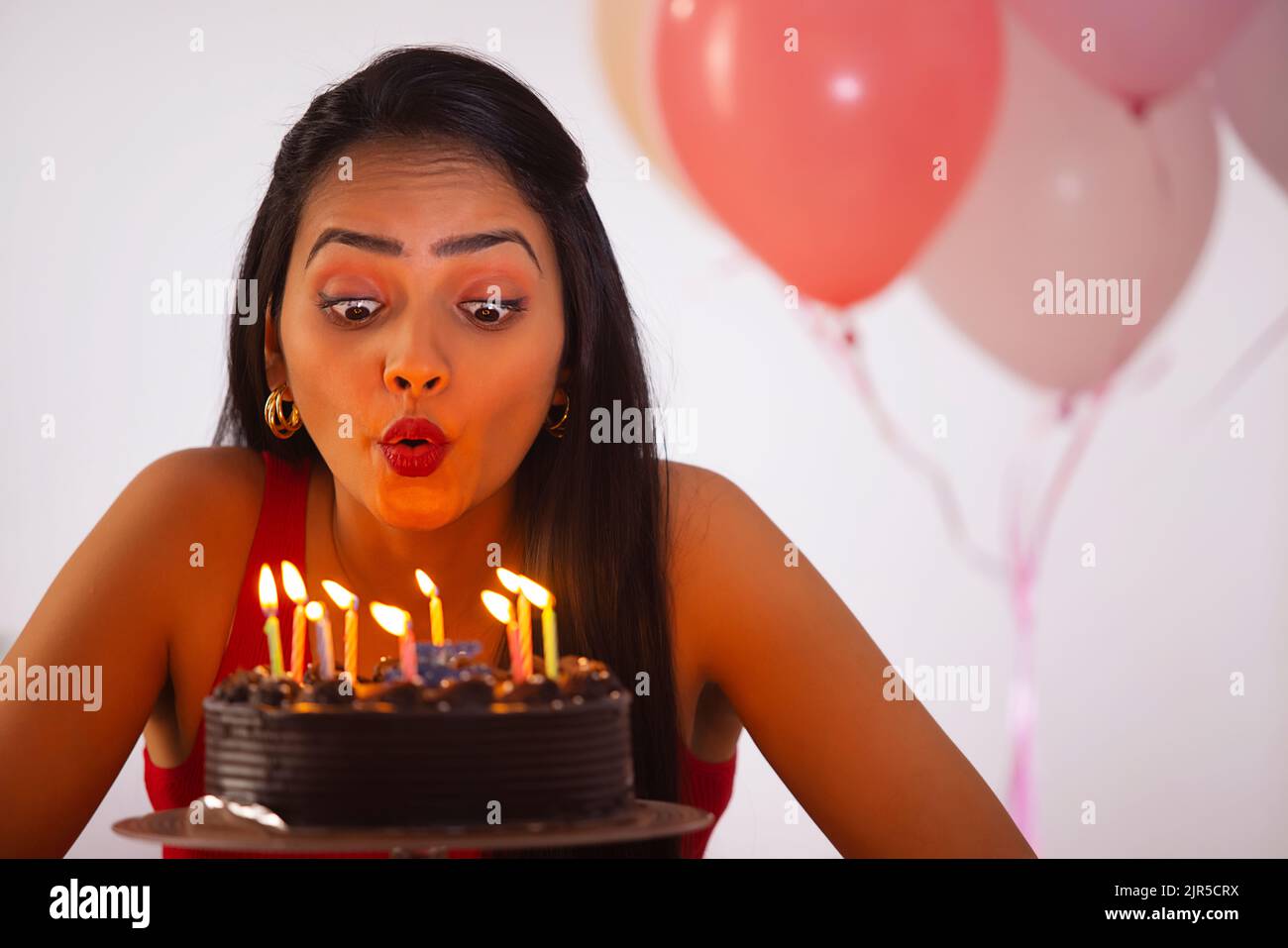 Woman blowing candles birthday hires stock photography and images Alamy