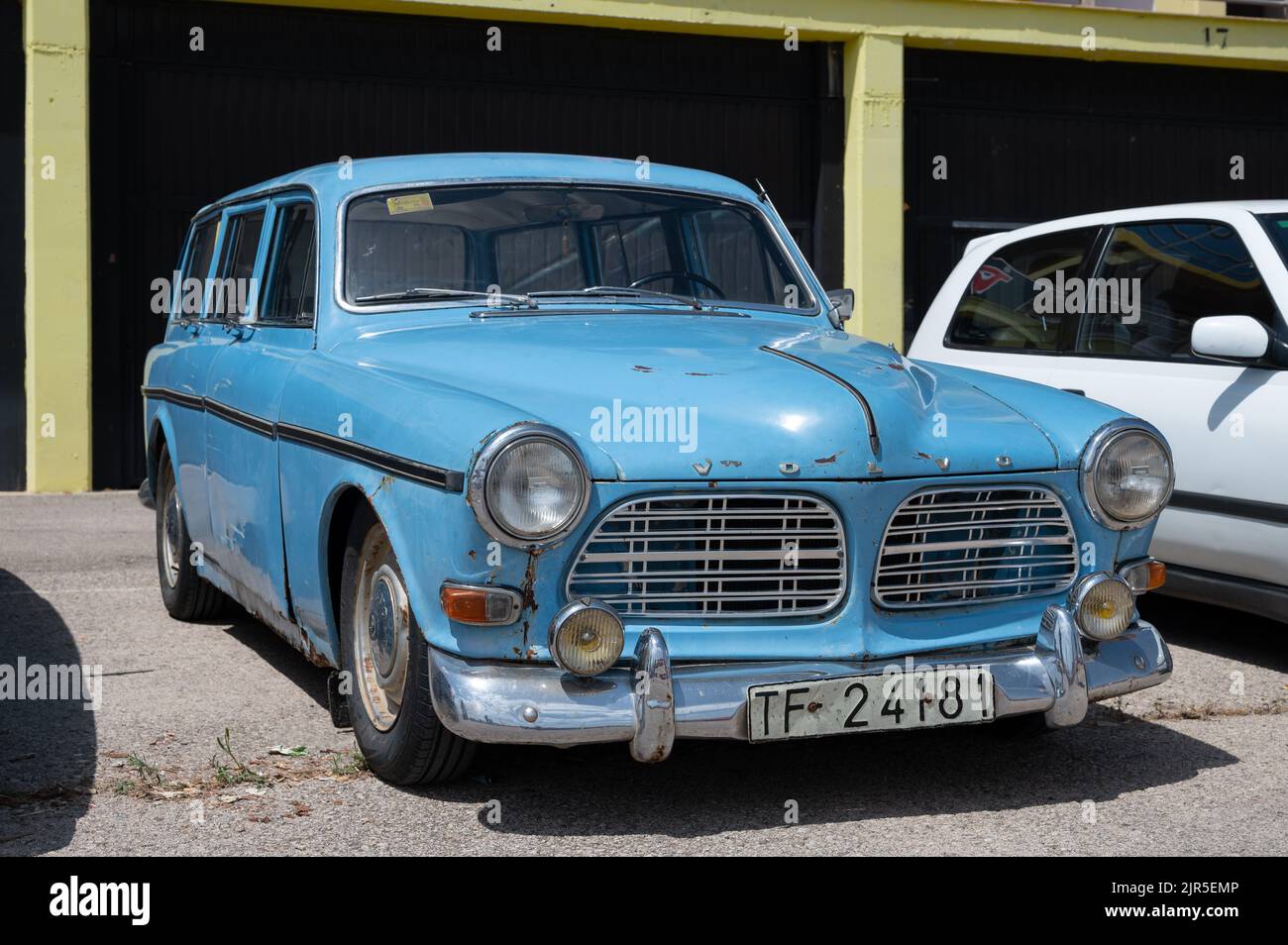 A blue classic Volvo Amazon car parked on the street Stock Photo