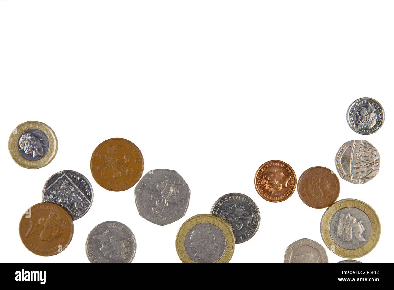 A Flat Lay background of British Coins isolated on a white background with copy space. Stock Photo