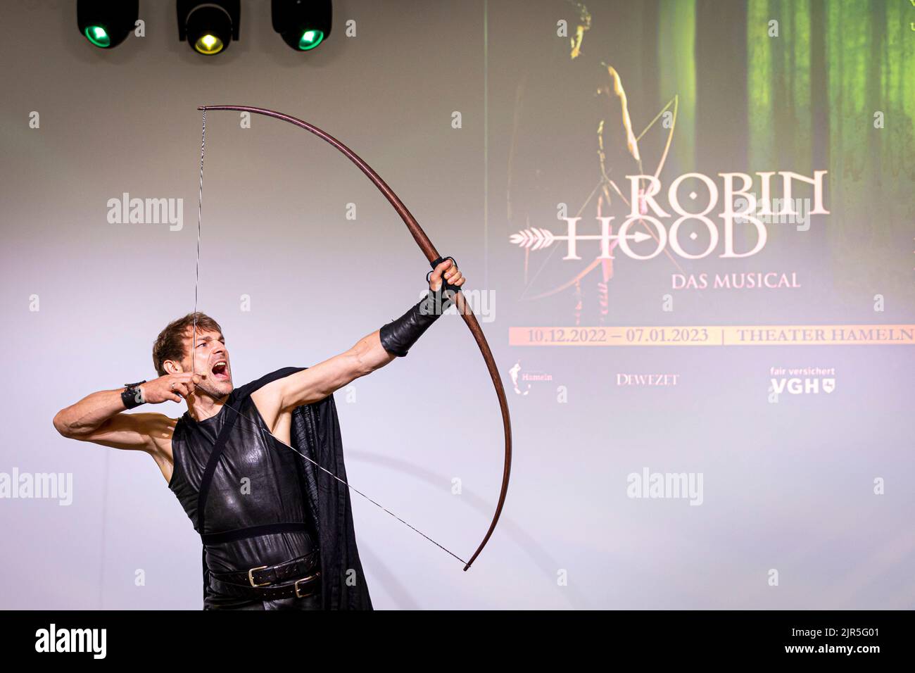 Hanover, Germany. 22nd Aug, 2022. Musical actor Friedrich Rau (role: Robin  Hood) plays a scene at the press conference for the musical "Robin Hood".  The musical will be seen in Hamelin from