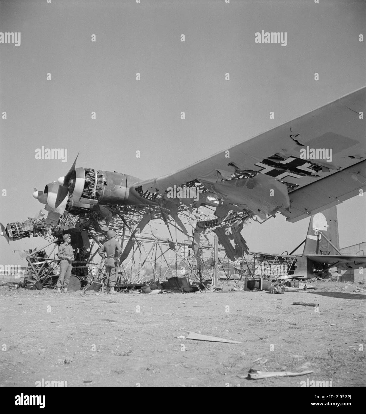 A vintage photo circa May 1943 showing a wrecked German Messerschmitt Me 323 Gigant transport aircraft at El Aouiana Tunisia after the defeat of the Axis forces in North Africa in World War Two Stock Photo