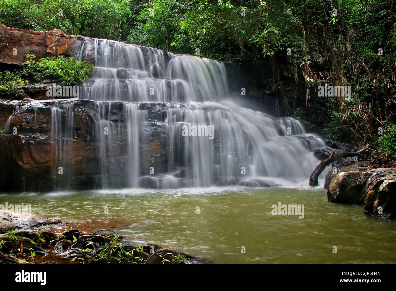 landscape photo, beautiful waterfall in green forest Stock Photo