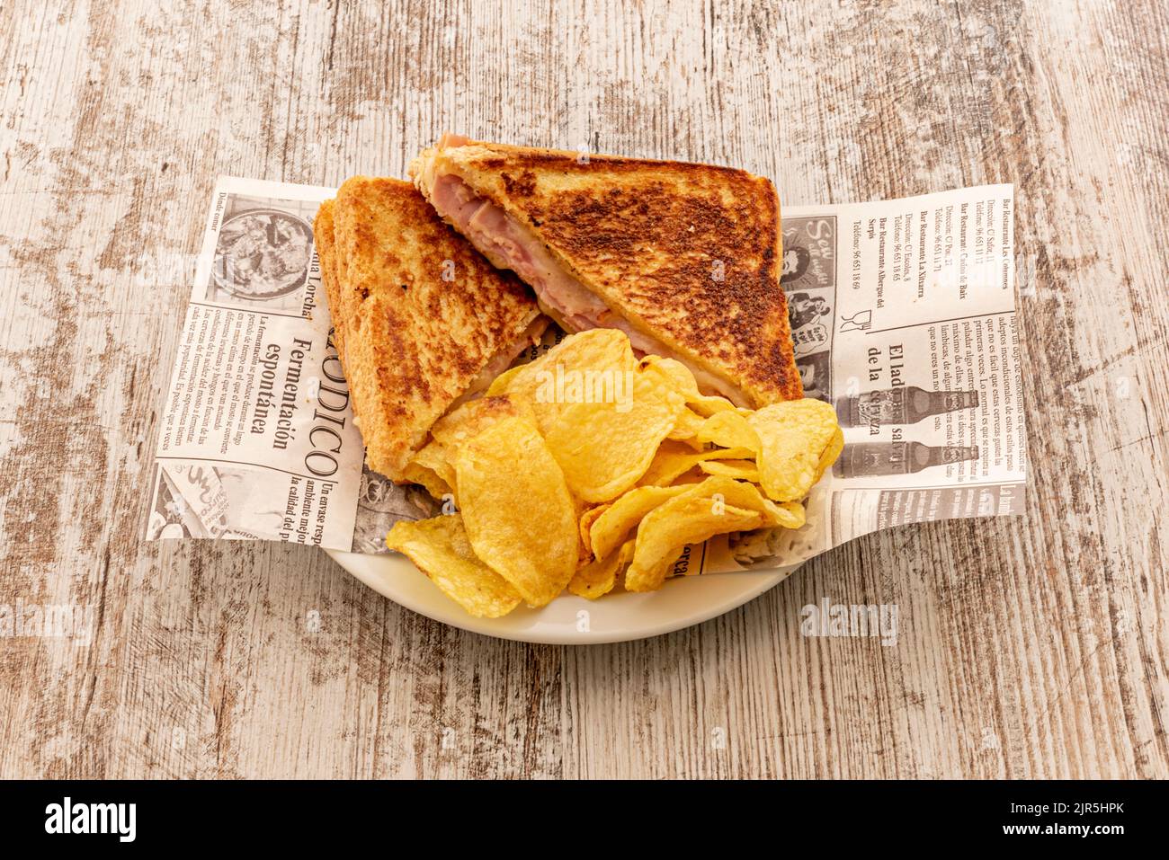 Delicious mixed sandwich cooked on the grill with melted cheese and