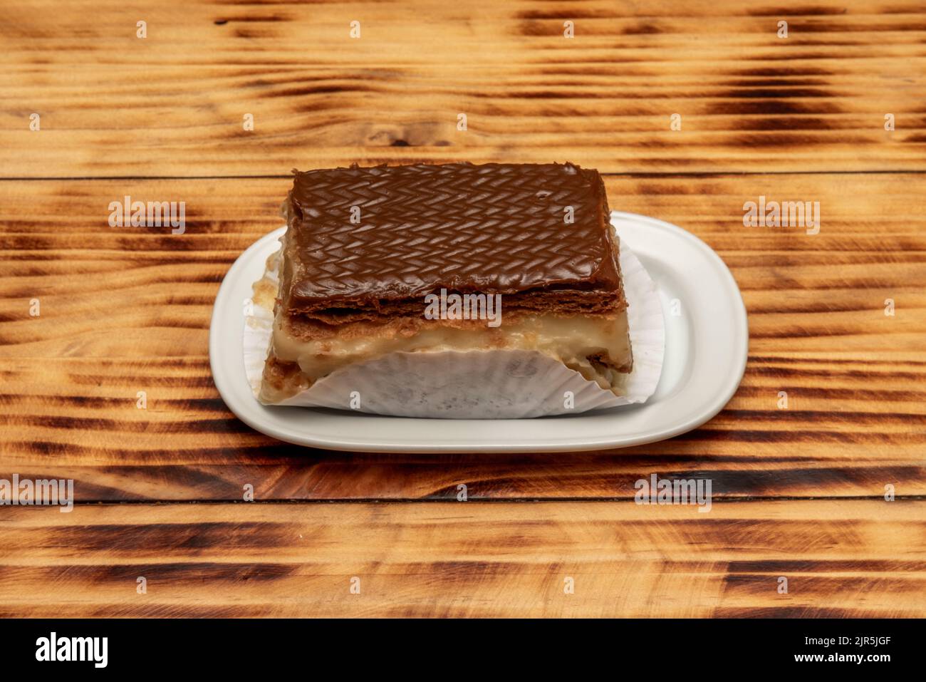 The mille-feuille in Venezuela is prepared in a traditional way, it is made with alternate layers of puff pastry and pastry cream, it is usually sprin Stock Photo