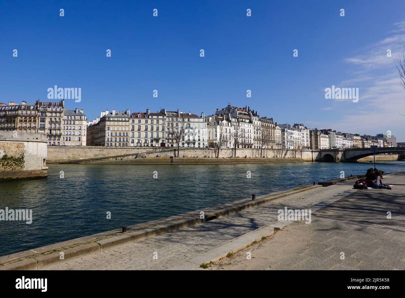 Looking from the Quai Saint Bernard in the 5th arrondissement, across the Seine River on a warm, clear spring day, Paris, France. Stock Photo