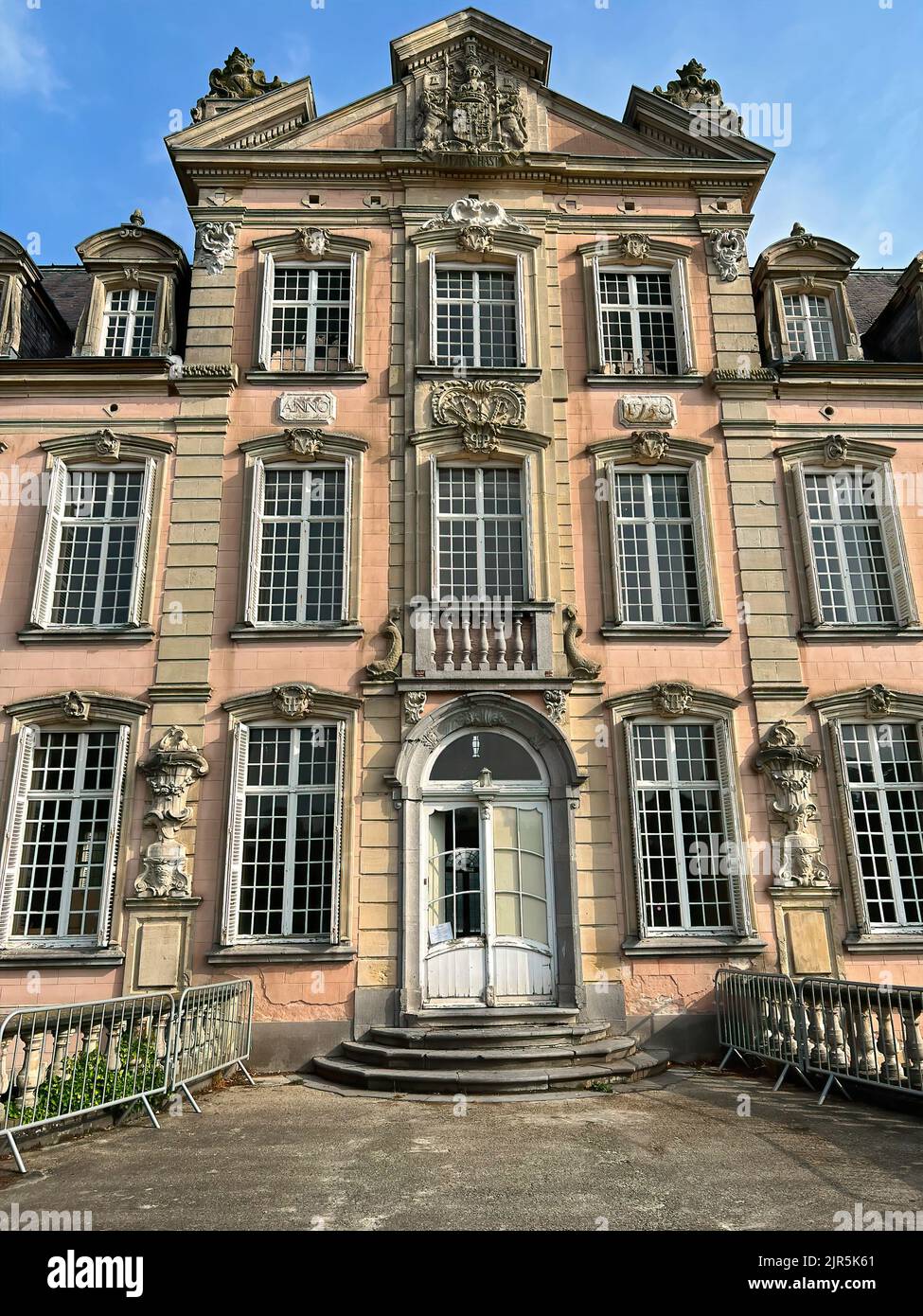 Vertical wide angle frontal sunny closeup on the historic Poeke Castle ...