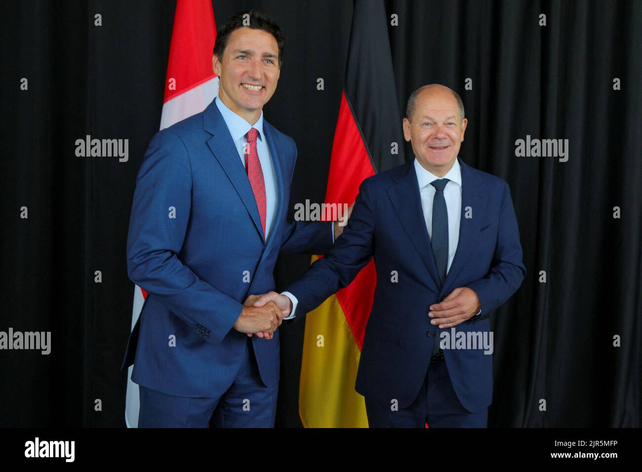 Canada's Prime Minister Justin Trudeau shakes hands with Germany's Chancellor Olaf Scholz during their meeting at the Montreal Science Centre in Montreal, Quebec, Canada August 22, 2022.  REUTERS/Christinne Muschi Stock Photo