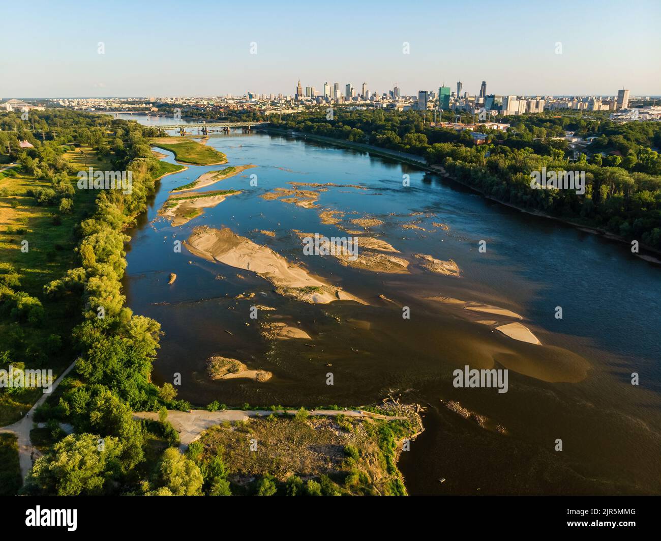 Low water level in Vistula river, effect of drought seen from the bird's eye perspective. City Warsaw in a distance. Stock Photo