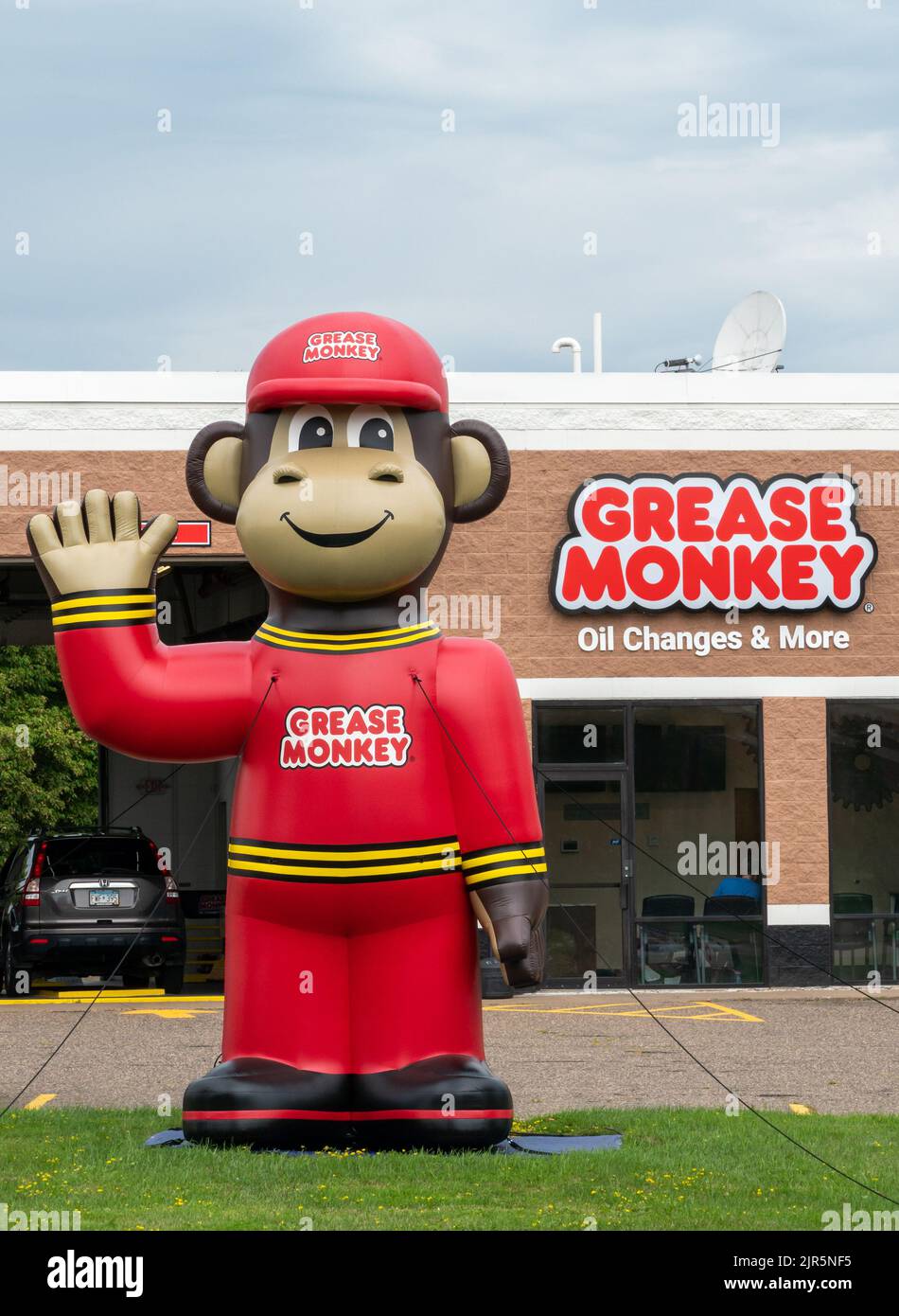 STILLWATER, MN, USA - JUNE 18, 2022 - Grease Monkey automotive repair faciliy exterior and trademark logo. Stock Photo