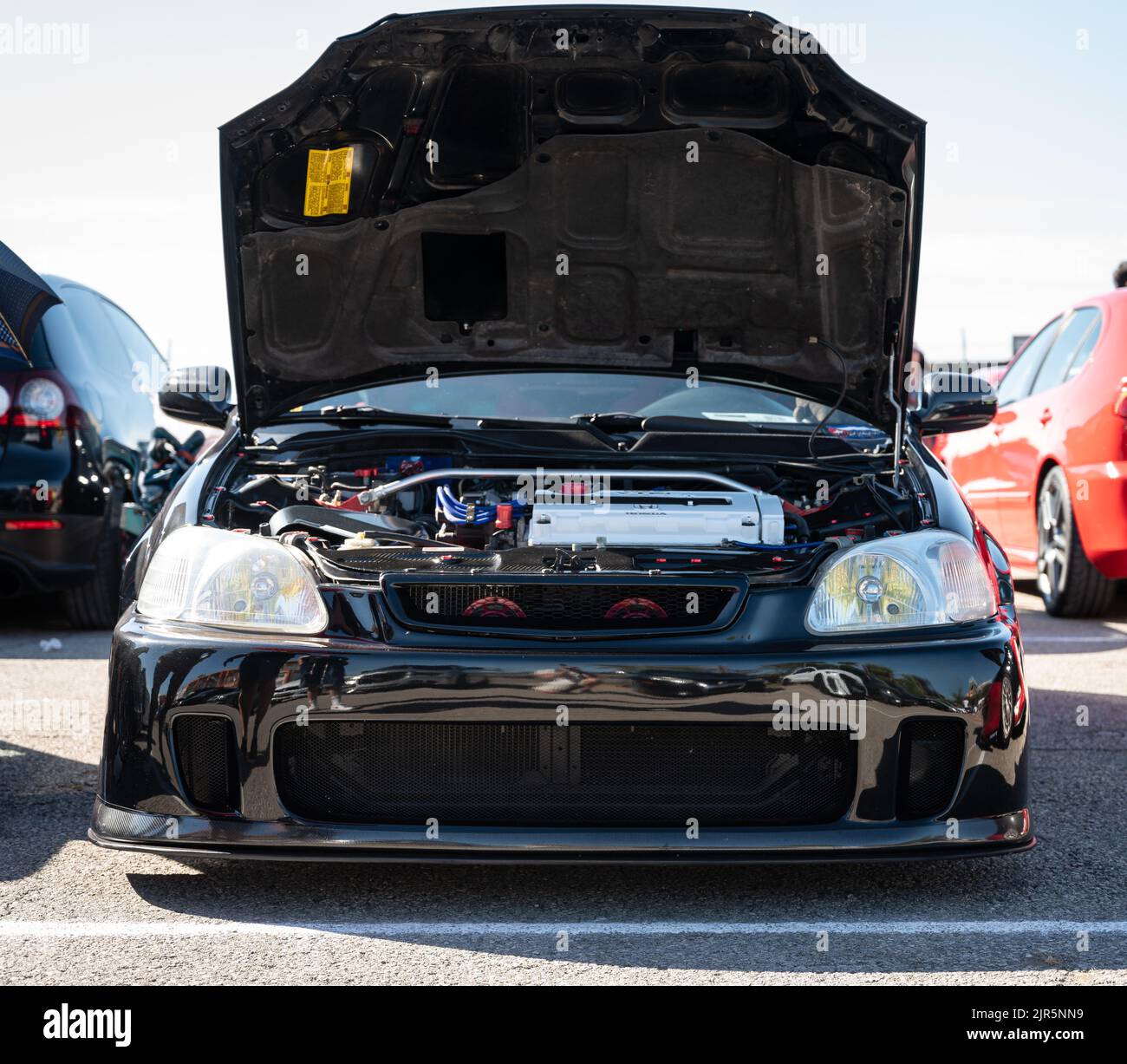 A black classic Japanese sports car 6th generation Honda Civic EK with