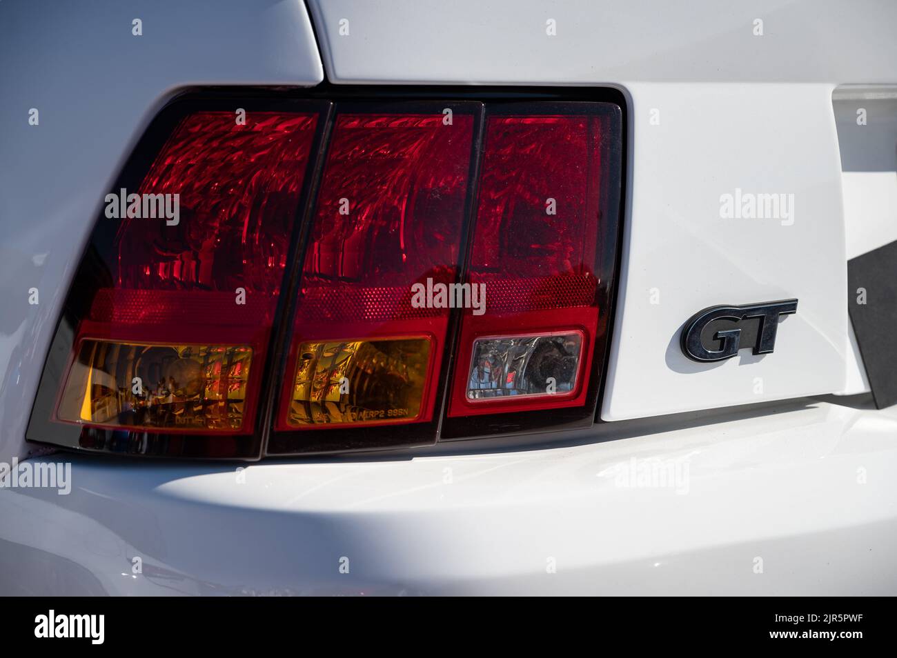 The details of the rear of a white Ford Mustang GT Stock Photo