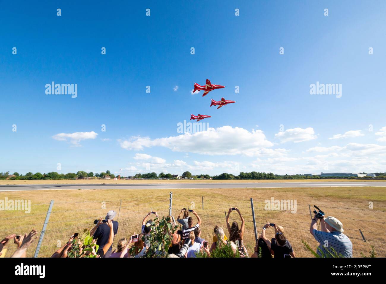 Royal Air Force Red Arrows BAe Hawk jet planes take off at London Southend Airport whilst using it as a base to display at Eastbourne airshow. Fans Stock Photo