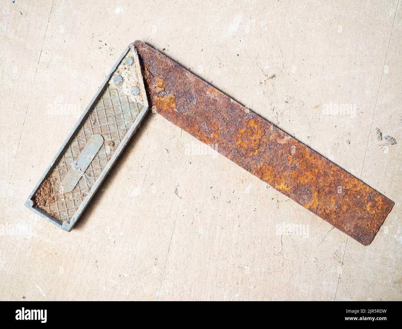 oldie rusted Iron Ruler with angle bar, set square Stock Photo Alamy