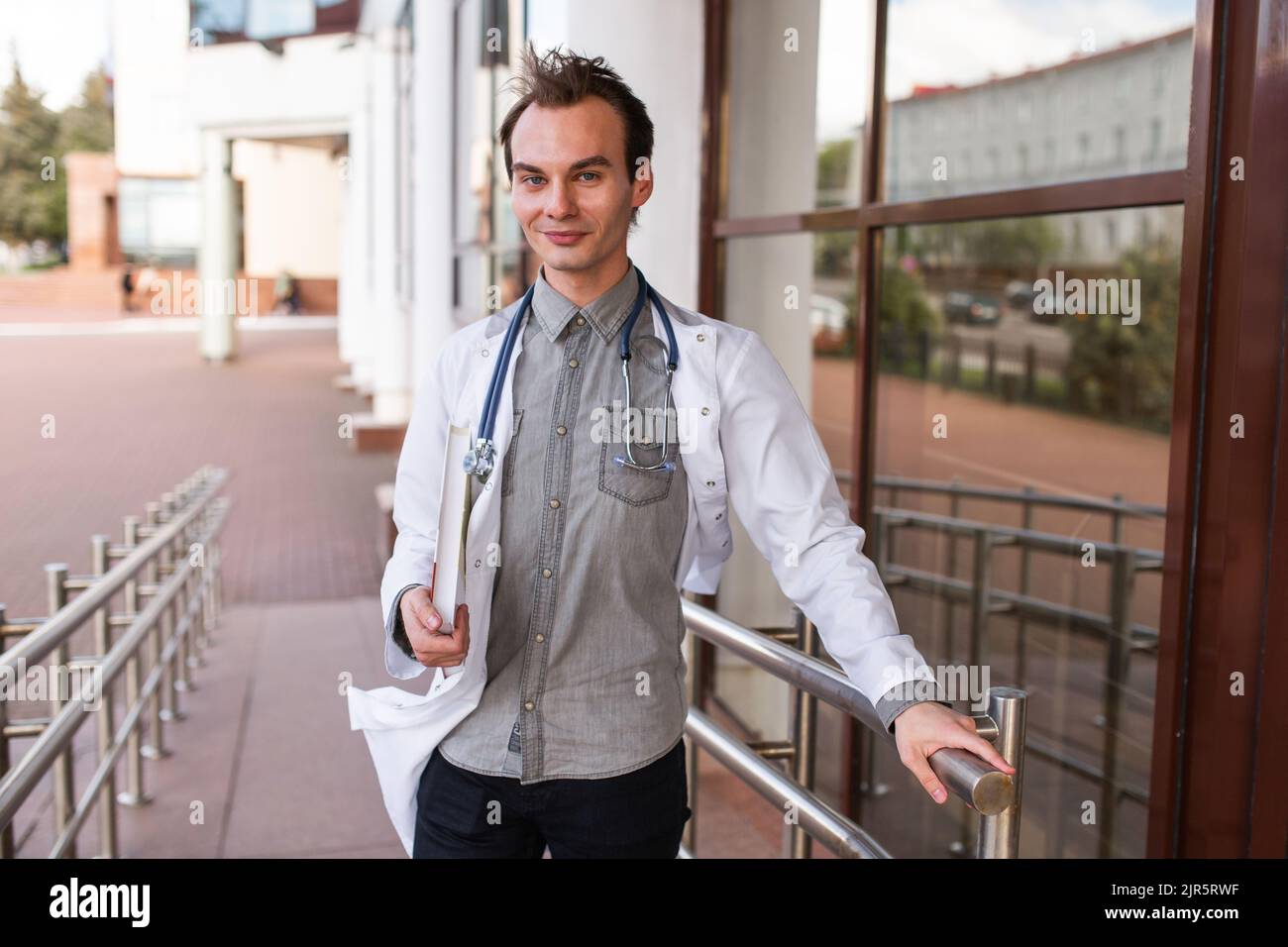 Portrait of a medical student on the threshold of a university clinic. The concept of modern education. Stock Photo
