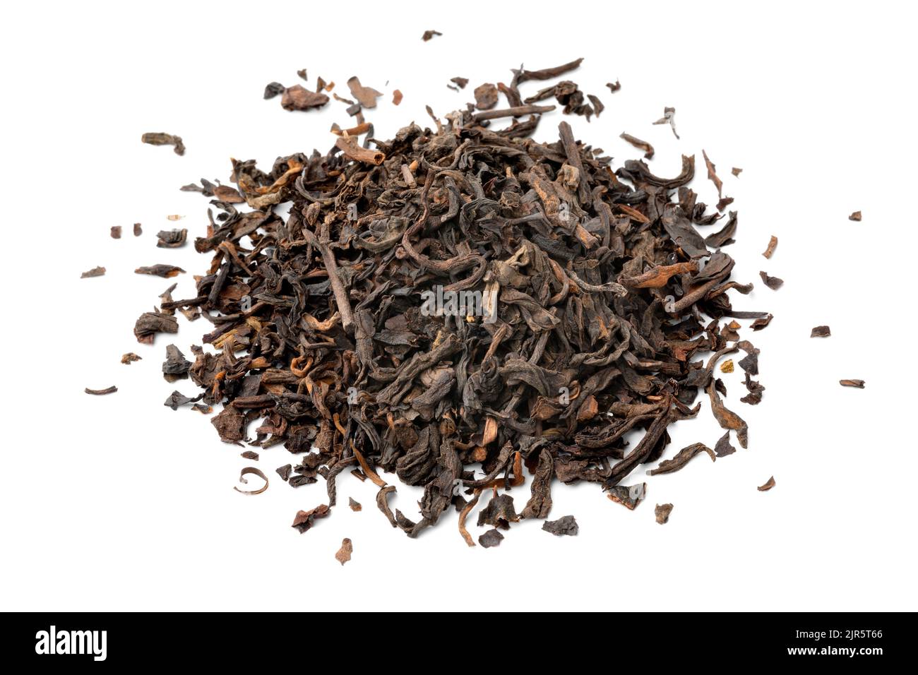 Heap of  Chinese Pu Ehr dried tea leaves close up isolated on white background Stock Photo