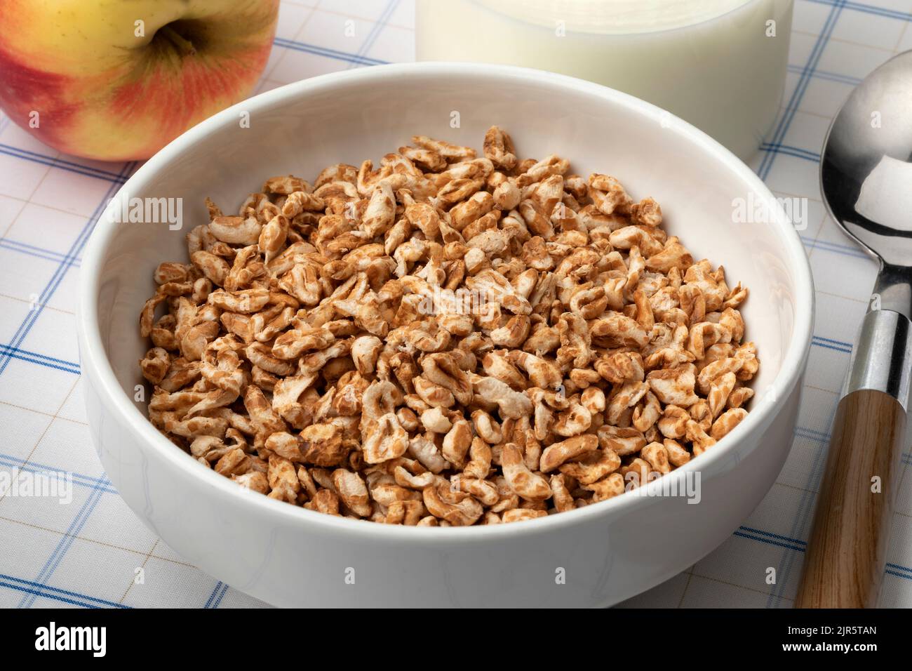 Bowl with healthy puffed oat close up for breakfast Stock Photo