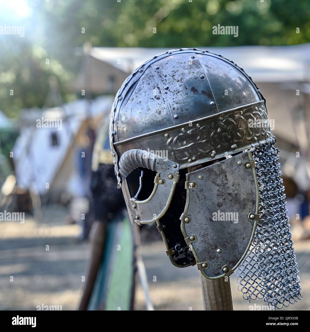 Medieval helmet with circumferential decoration and protective elements ...