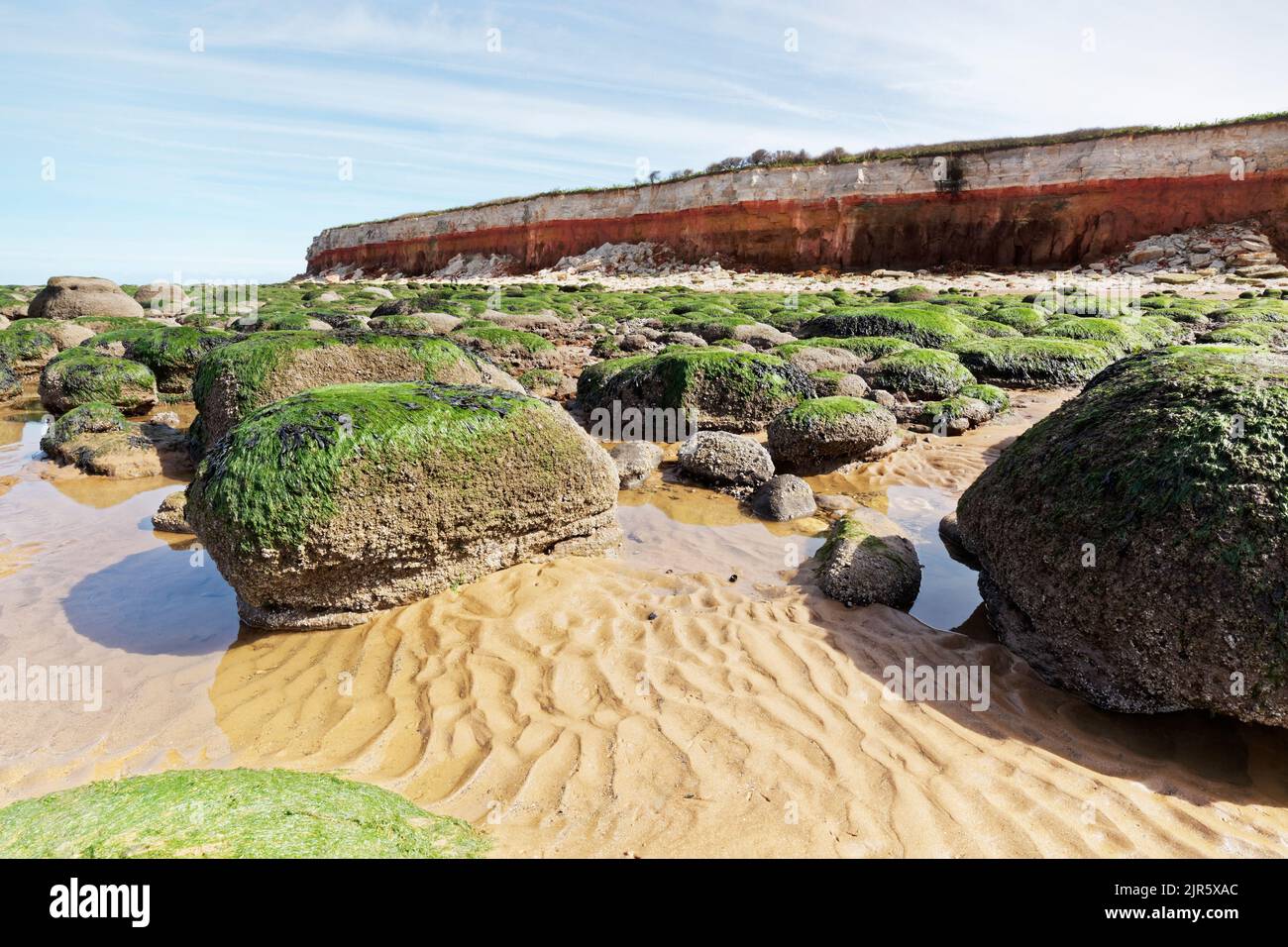 Old Hunstanton beach with red and white striped cliffs in Suffolk. Stock Photo