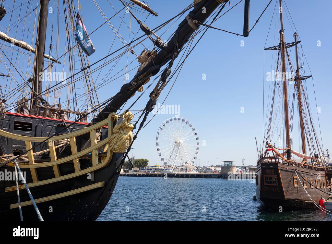 Harbor of Saint Malo with old historical wooden sail ships and  a ferris wheel Stock Photo