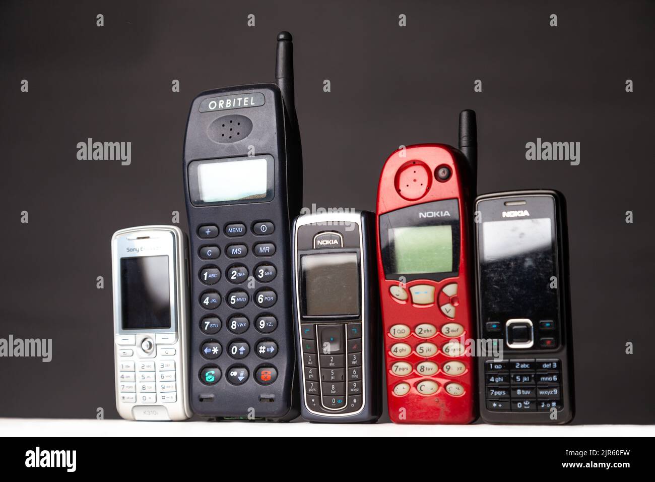 A group of old out dated mobile dumb phones Stock Photo