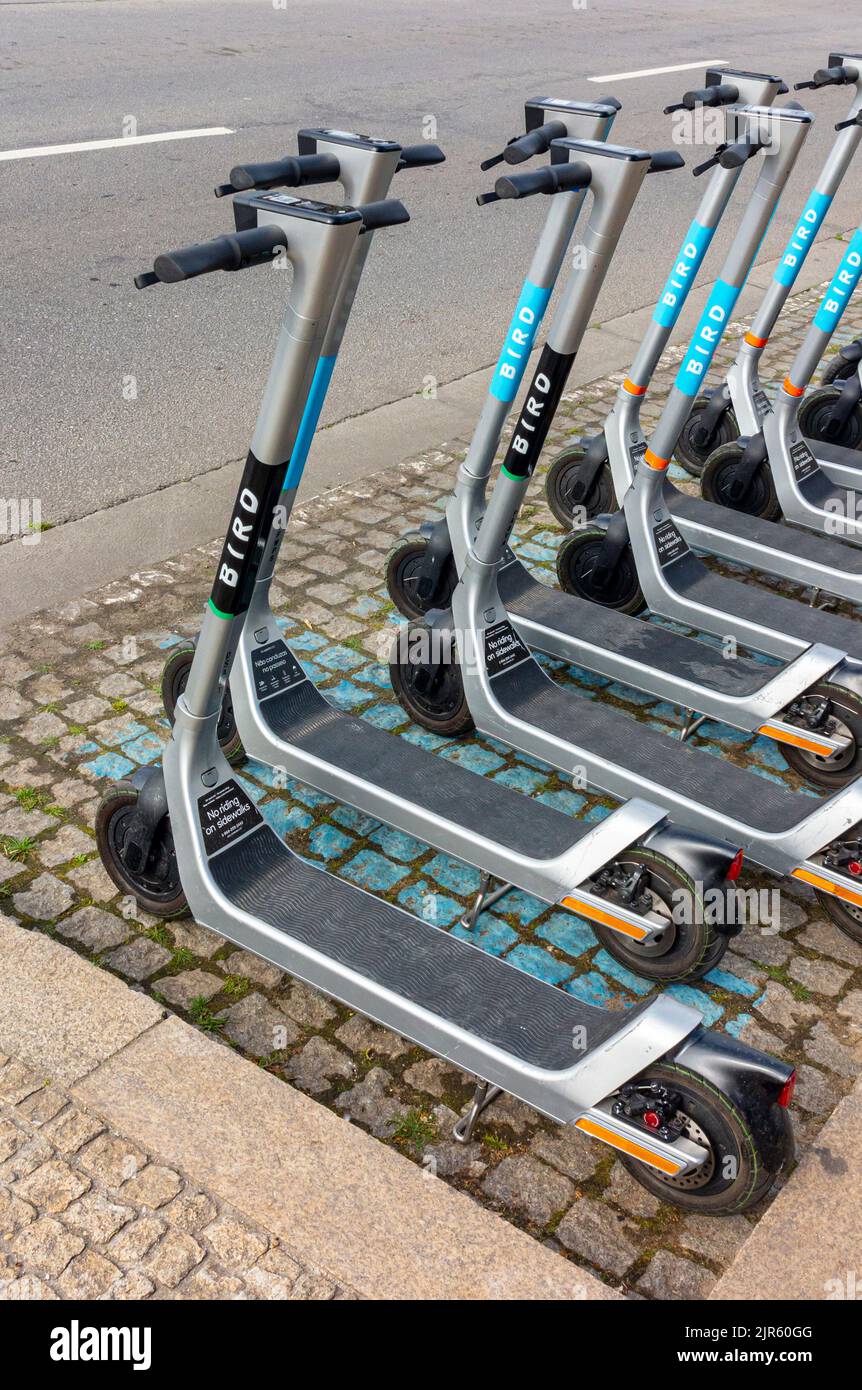 Electric scooters available for hire on a street in Porto a major city in northern Portugal. Stock Photo