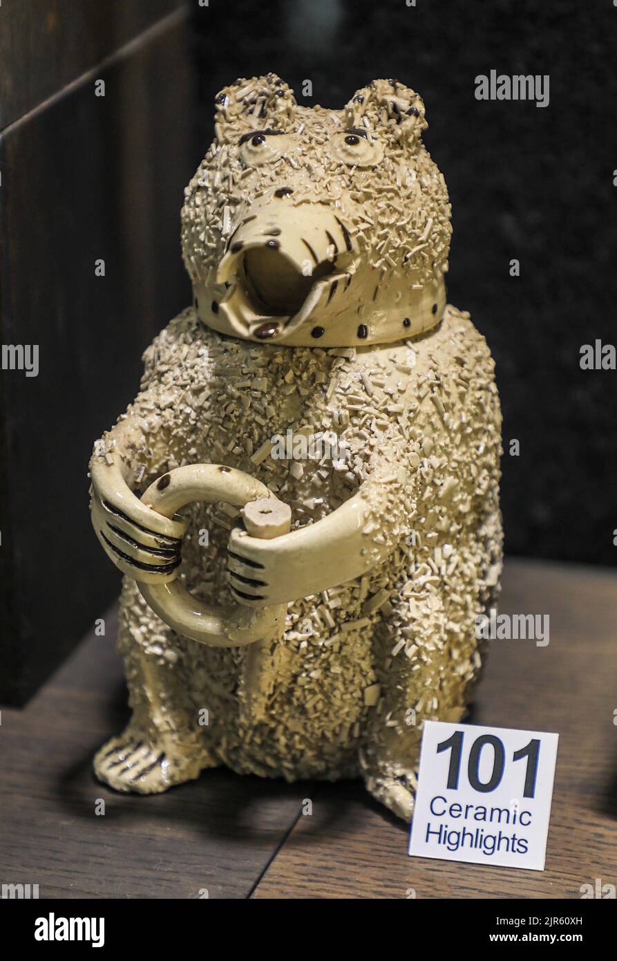 White salt-glazed stoneware jar in the form of a baited bear, on display at the Potteries Museum, Hanley, Stoke-on-Trent, Staffs, England, UK Stock Photo
