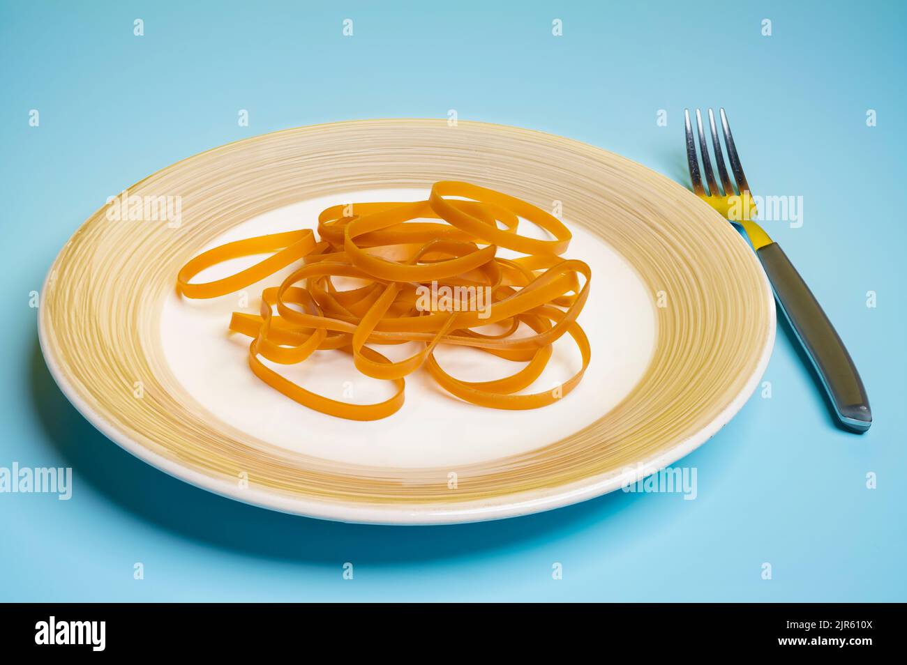 a handful of rubber bands on a plate Stock Photo