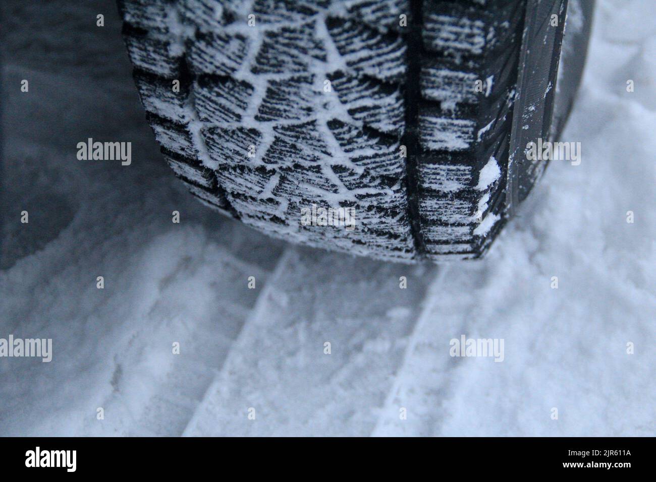 Winter car tire tread with snow between blocks Stock Photo