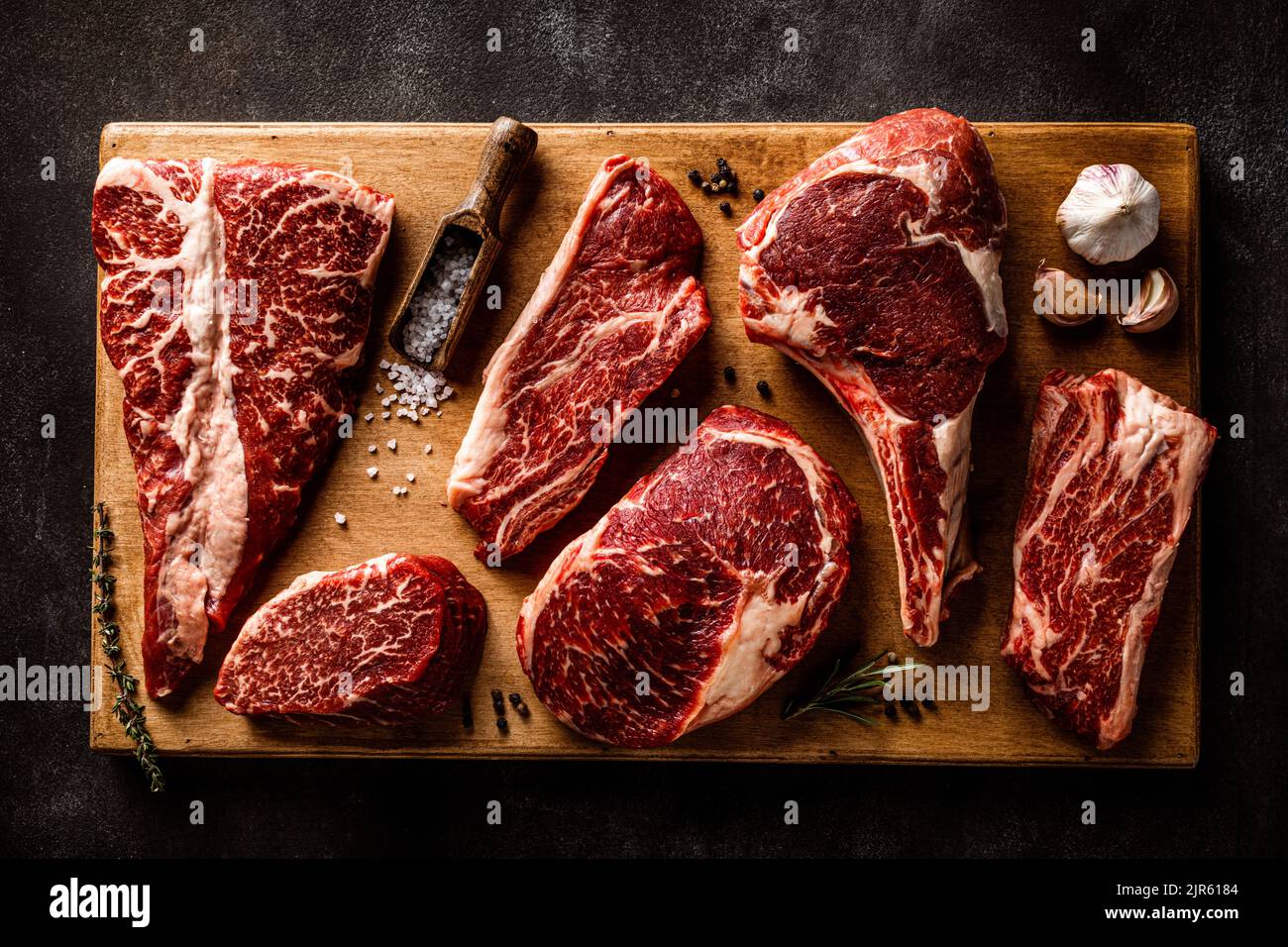 Variety of raw beef steaks for grilling top view Stock Photo Alamy