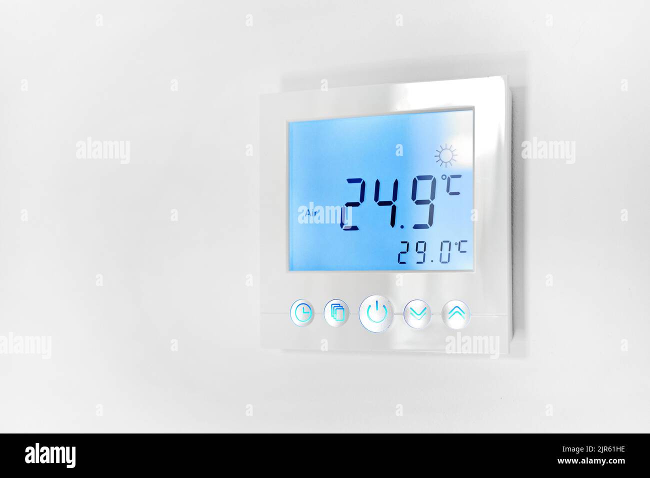Close up shot mounted on white wall, climate control indoor, remote air-conditioner inside smart home close up view, no people. Modern tech, comfort l Stock Photo