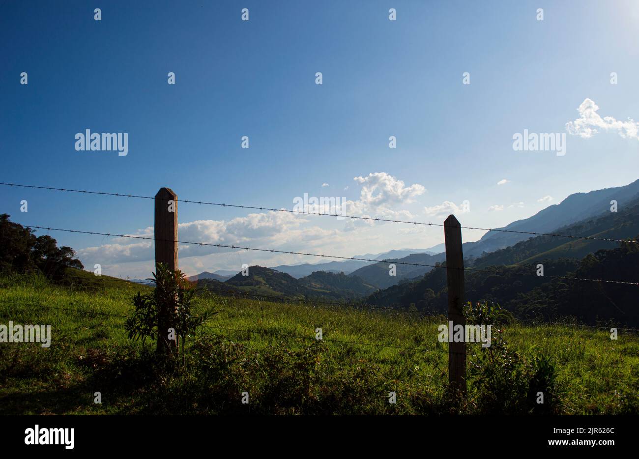 Rural Fence With Mountains. Serra da Mantiqueira, Minas Gerais, Brazil. Stock Photo