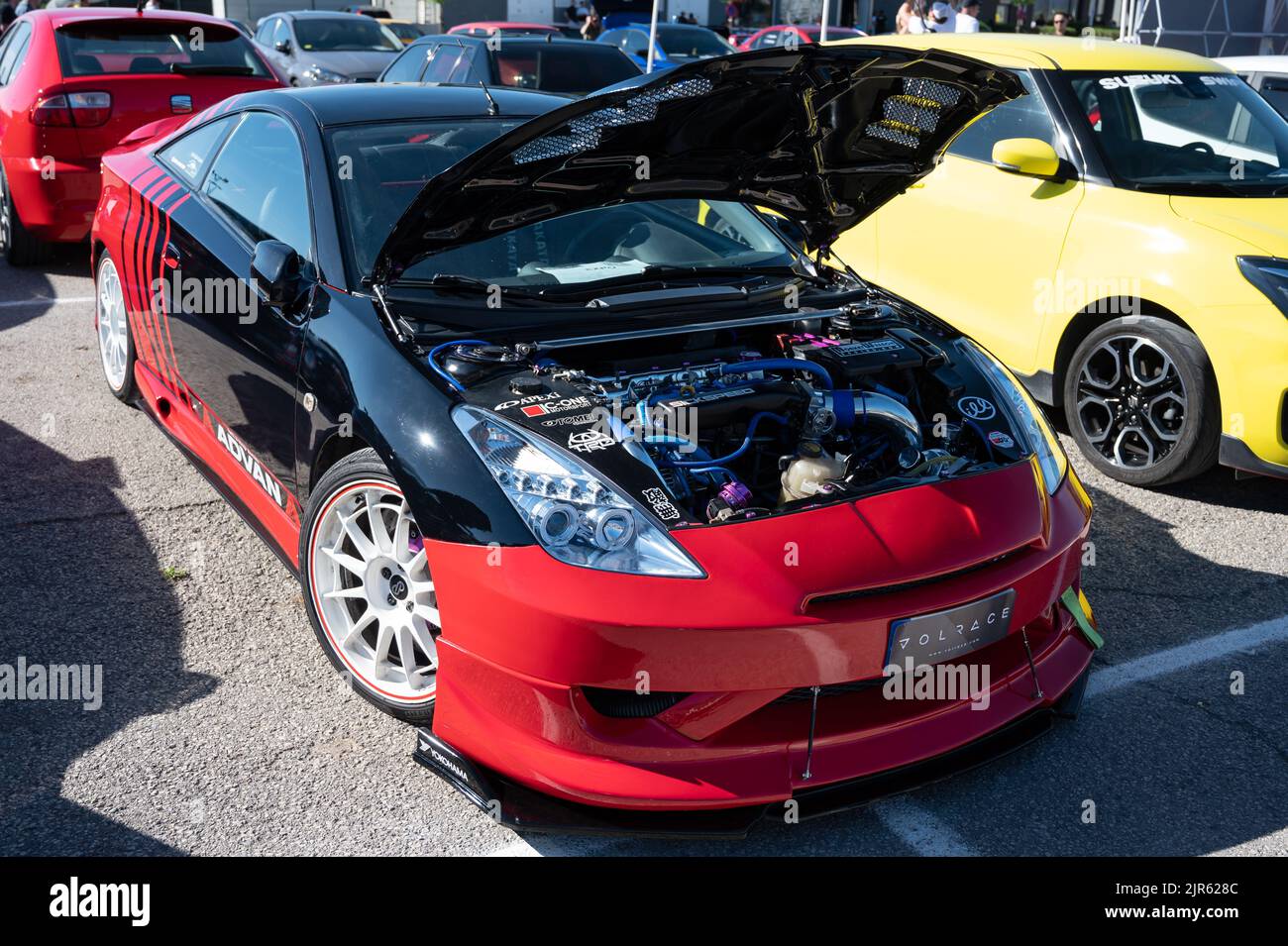 A red Toyota Celica sports car with an open hood Stock Photo