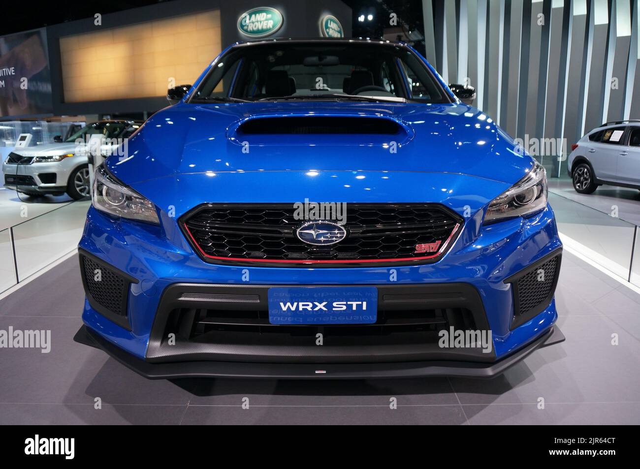 A closeup shot of the front of a blue Subaru STI at the LA Auto Show Stock Photo