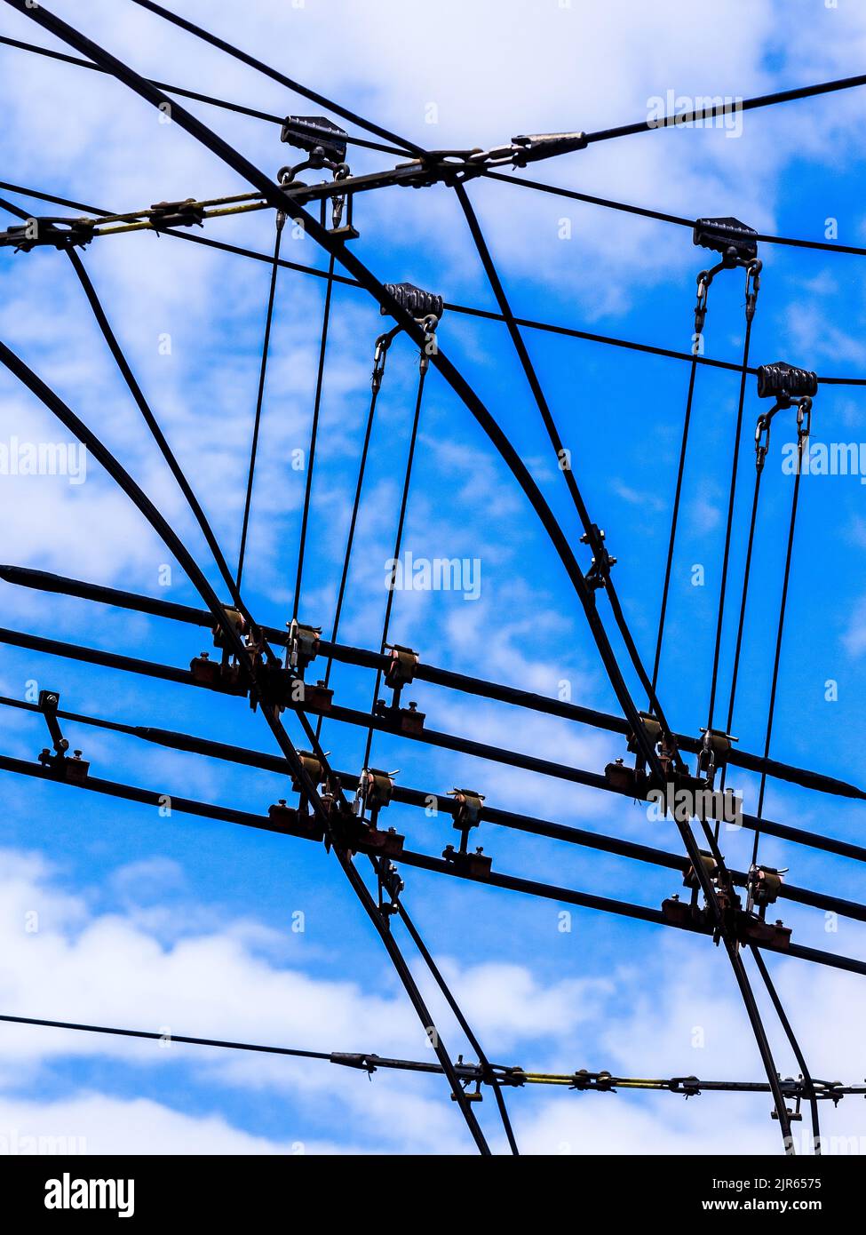 Overhead 600 volt electric power lines for the Limoges trolleybus transport system - Limoges, Haute-Vienne (87), France. Stock Photo