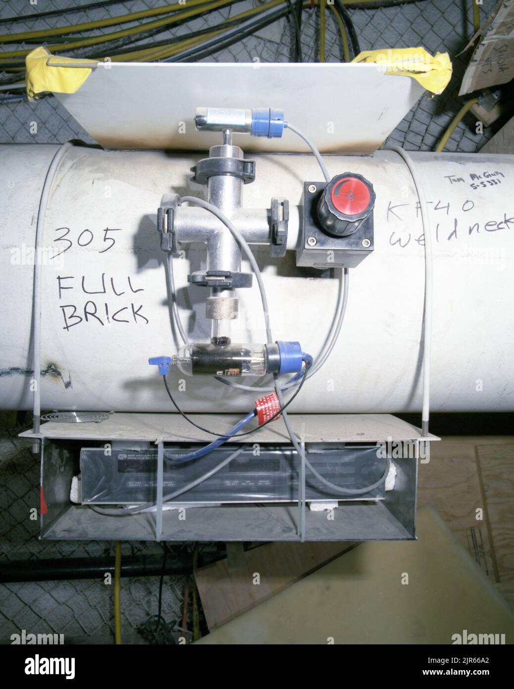 A900626 U12N MINERAL QUARRY LPARL VACUUM TUBE JERRY CHAEL (Project Engineer) JUL 18 90 EG&G/NTS PHOTO LAB Publication Date: 7/18/1990  EDGERTON, GERMESHAUSEN & GRIER; EG&G; EQUIPMENT; EQUIPMENT & INSTRUMENTS; INSTRUMENTS & EQUIPMENT; INSTRUMENTS AND EQUIPMENT; LPARL VACUUM TUBE; MINERAL QUARRY; N-TUNNEL; NEVADA; NEVADA TEST SITE; NTS; NUCLEAR ENERGY TECHNOLOGY; TEST SITES; TUNNELS; UGT; UNDERGROUND TESTING; VACUUM TUBES; WEAPONS EFFECTS; WIRE & CABLES; WIRES  historical images. 1972 - 2012. Department of Energy. National Nuclear Security Administration. Photographs Related to Nuclear Weapons T Stock Photo