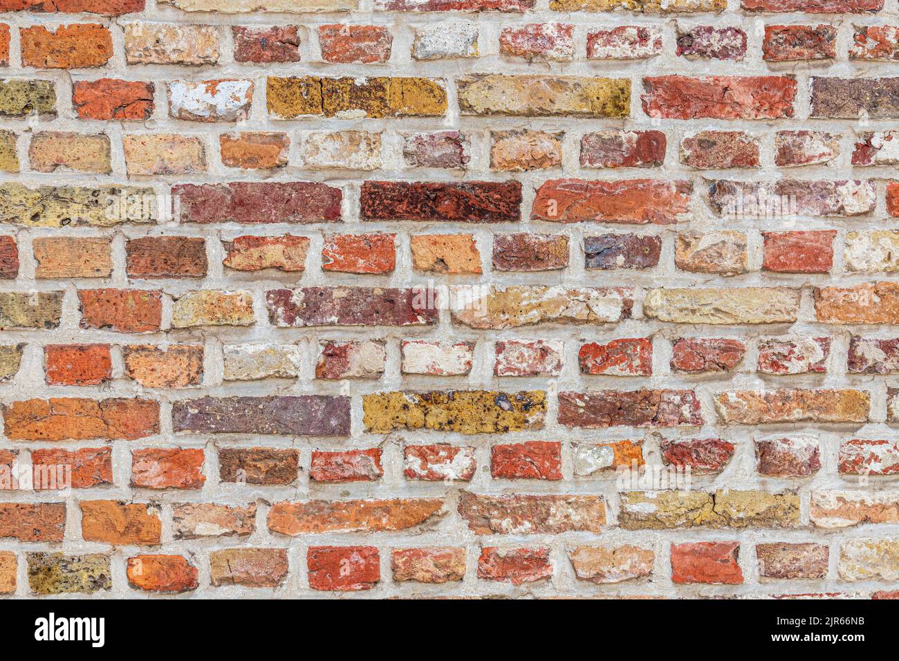 Unusual variant of English Bond brickwork with alternate rows of headers and stretchers (using reused bricks?) in Bruges, Belgium Stock Photo