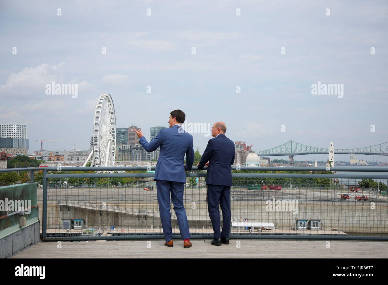 Germany's Chancellor Olaf Scholz and Canada's Prime Minister Justin Trudeau talk after a news conference outside the Montreal Science Centre, in Montreal, Quebec, Canada August 22, 2022. REUTERS/Christinne Muschi Stock Photo