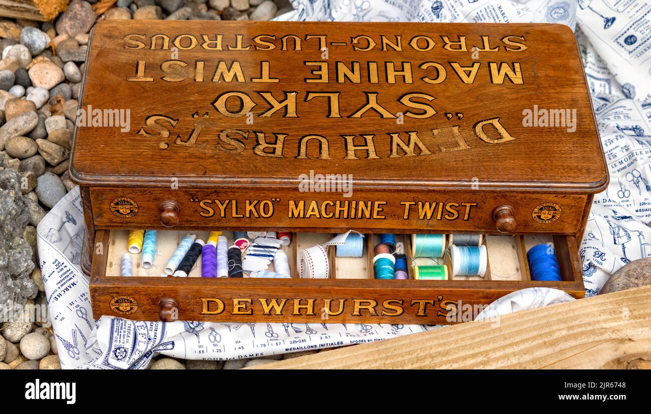 Sylko Machine Twist wooden box with colourful cotton reels within, Flamstead scarecrow festival, Hertfordshire UK Stock Photo