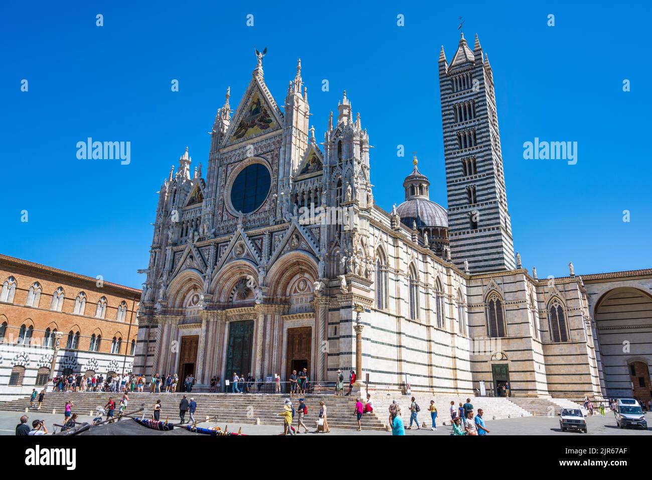 Siena Duomo (cathedral) and Campanile (bell tower) in Piazza del Duomo in Siena, Tuscany, Italy Stock Photo