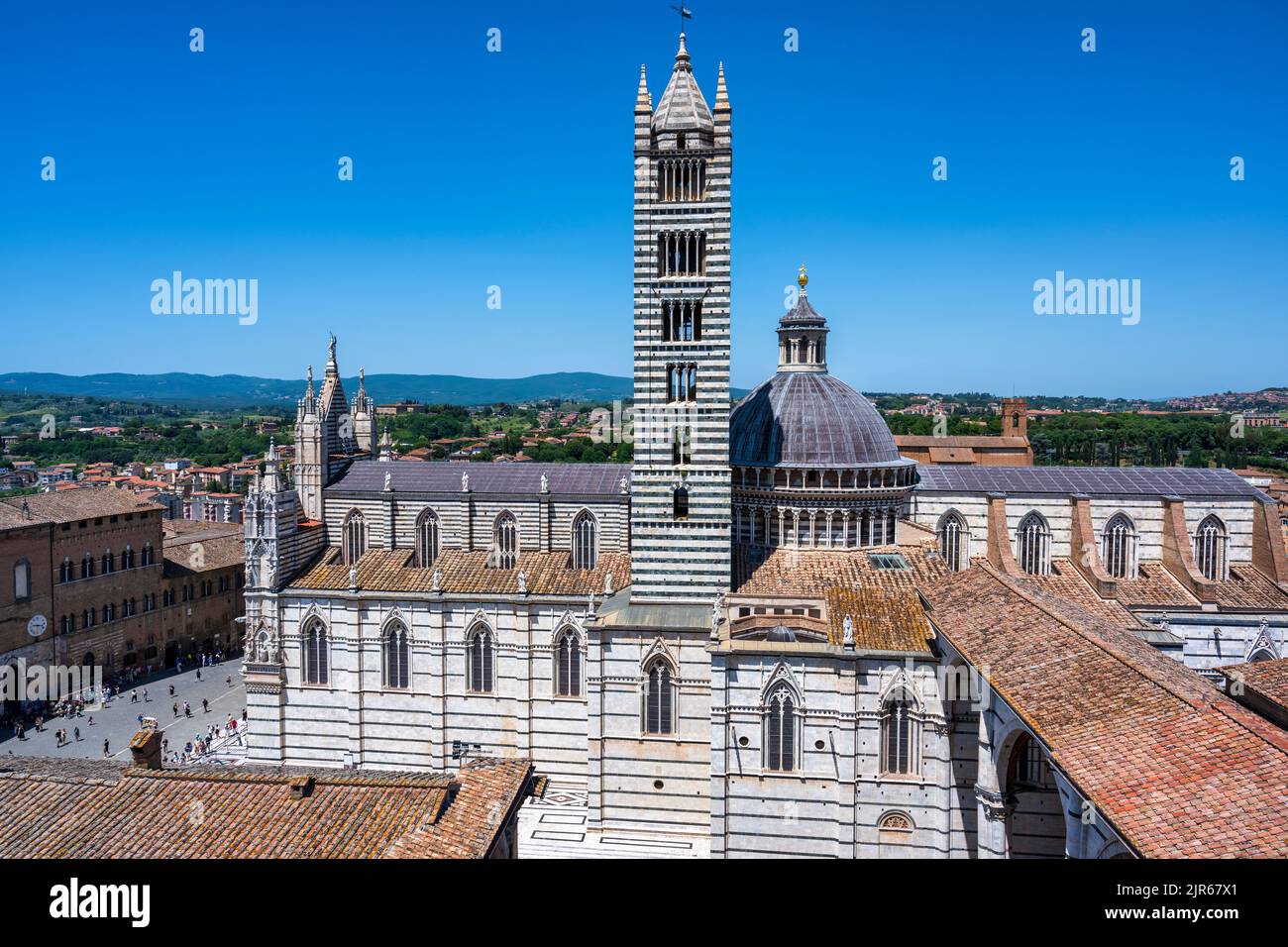 View of Duomo di Siena (cathedral) and Campanile (bell tower) from Facciatone observation point in Piazza del Duomo in Siena, Tuscany, Italy Stock Photo