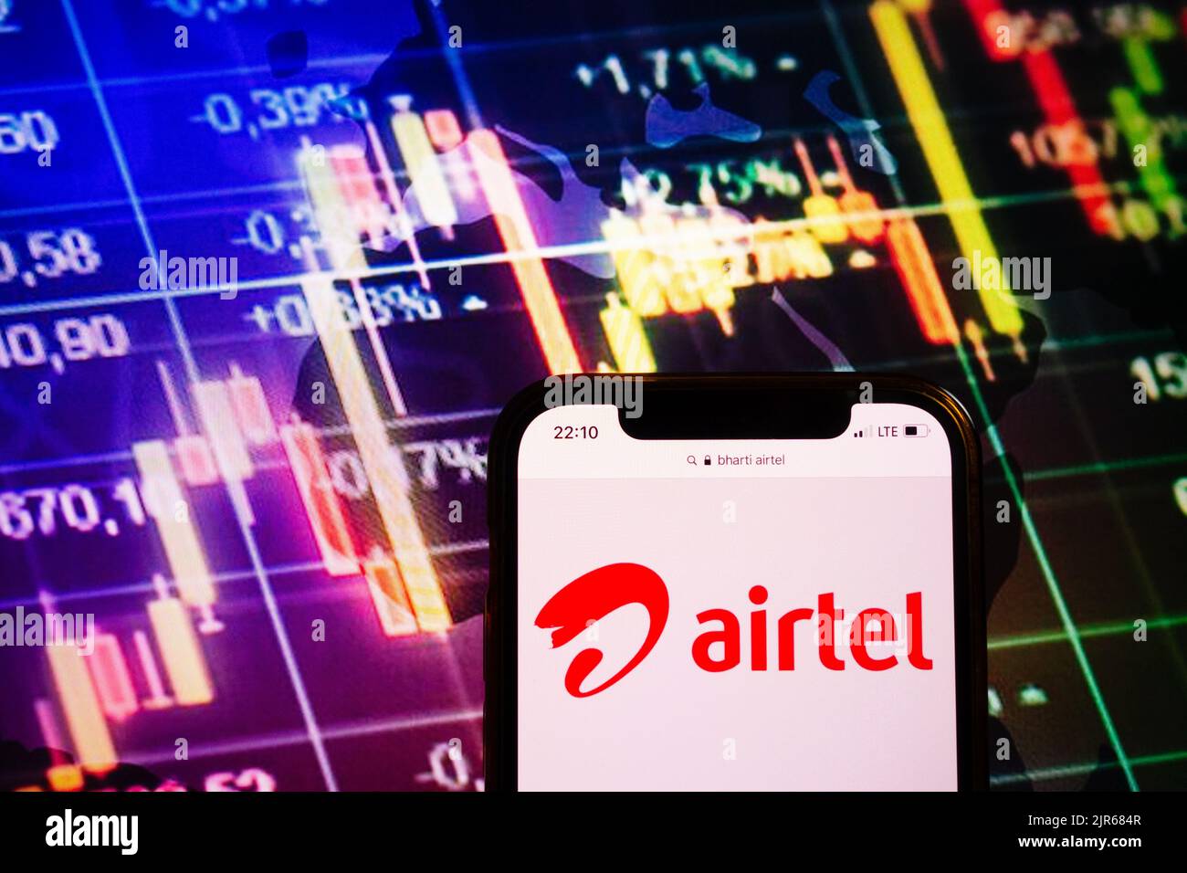 KONSKIE, POLAND - August 10, 2022: Smartphone displaying logo of Bharti Airtel company on stock exchange diagram background Stock Photo