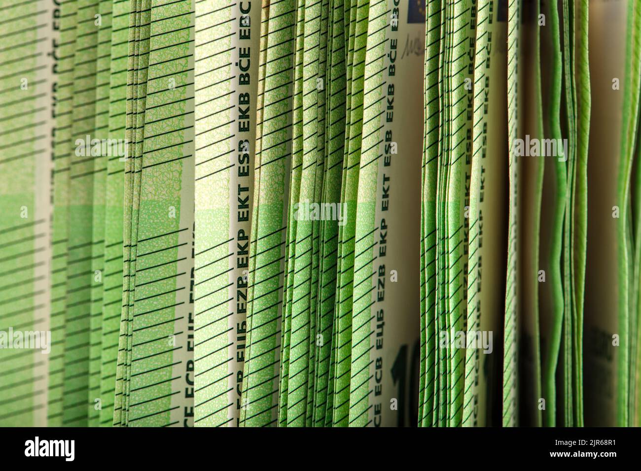 Closeup of a stack of paper bills, side view. Euro banknotes stacked