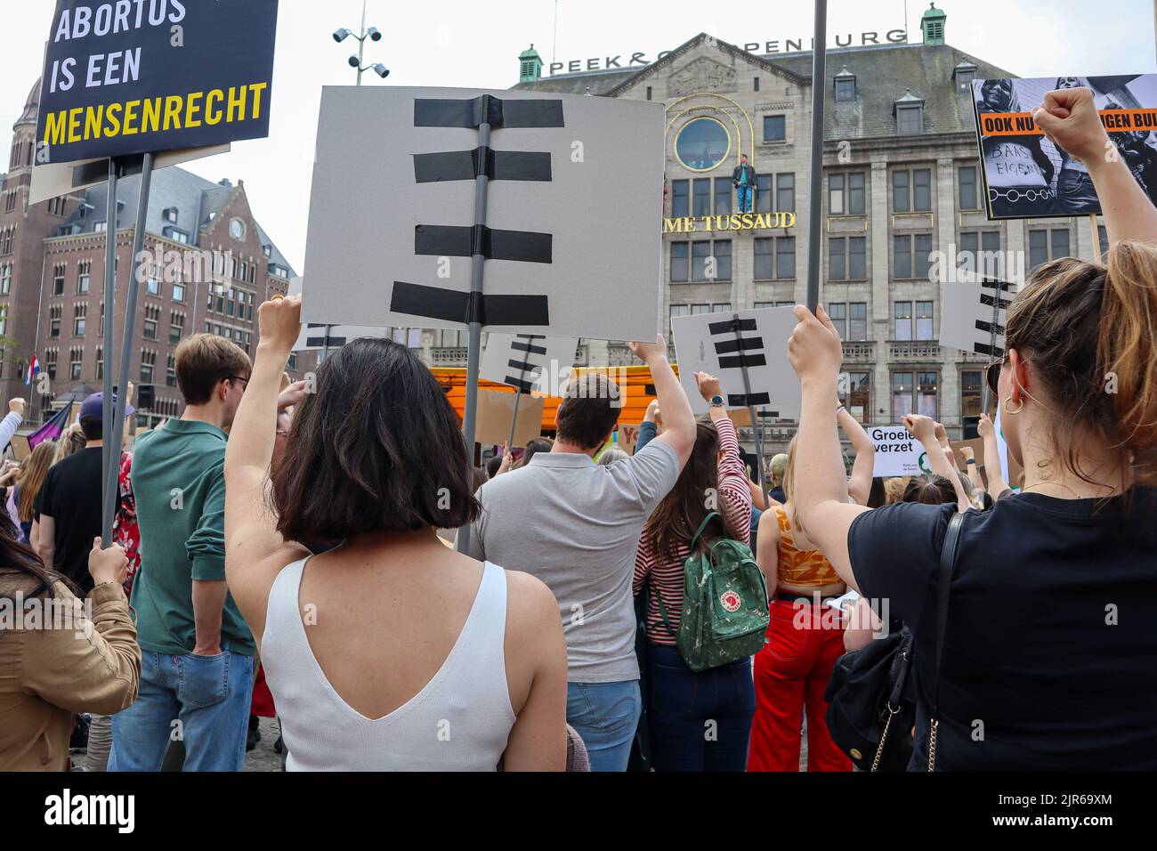 A crowd of people holding up her first at a pro-choice solidarity demonstration on the Dam, Amsterdam Stock Photo