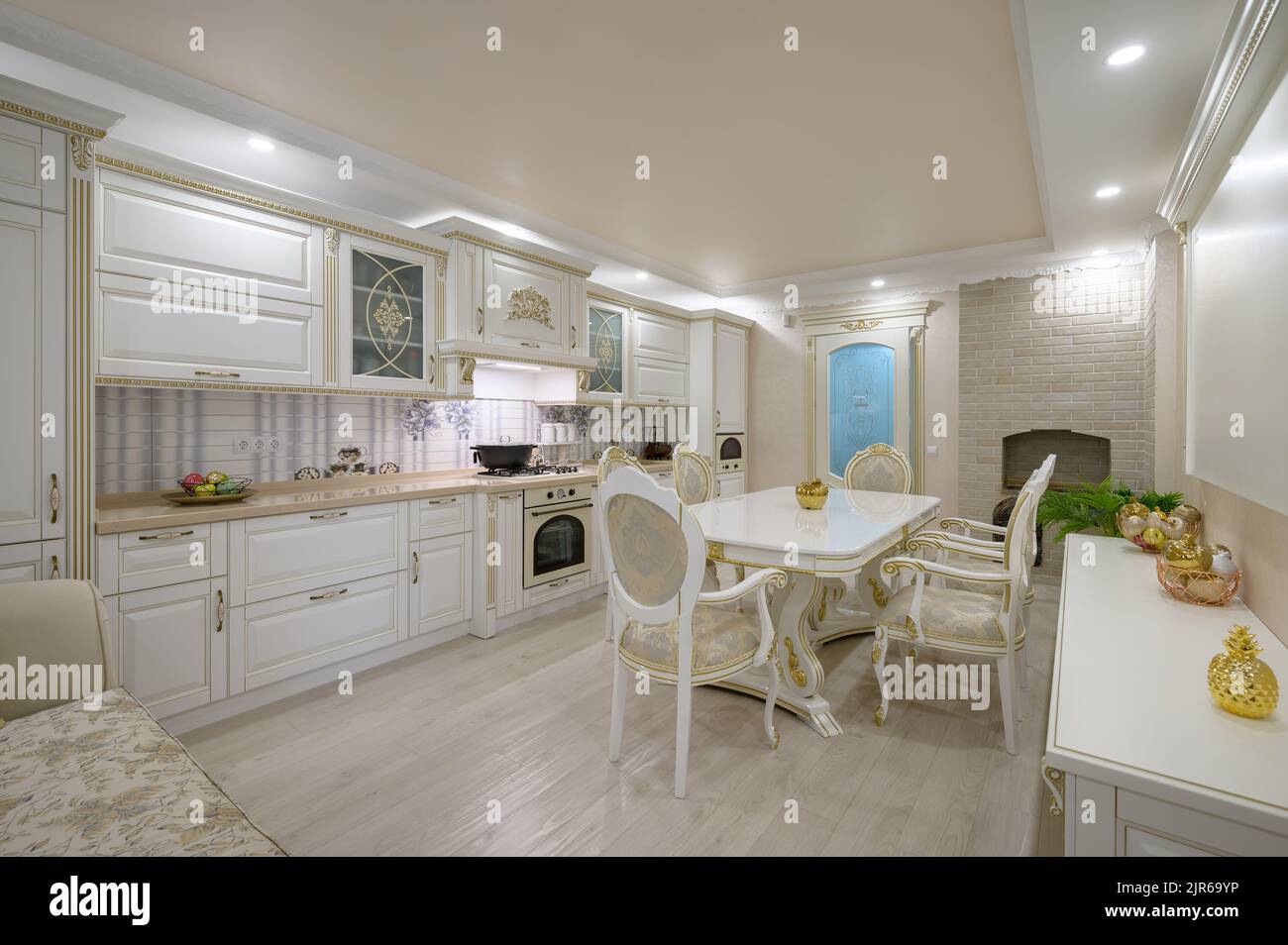 Renovated Interior of rich classic white kitchen Stock Photo