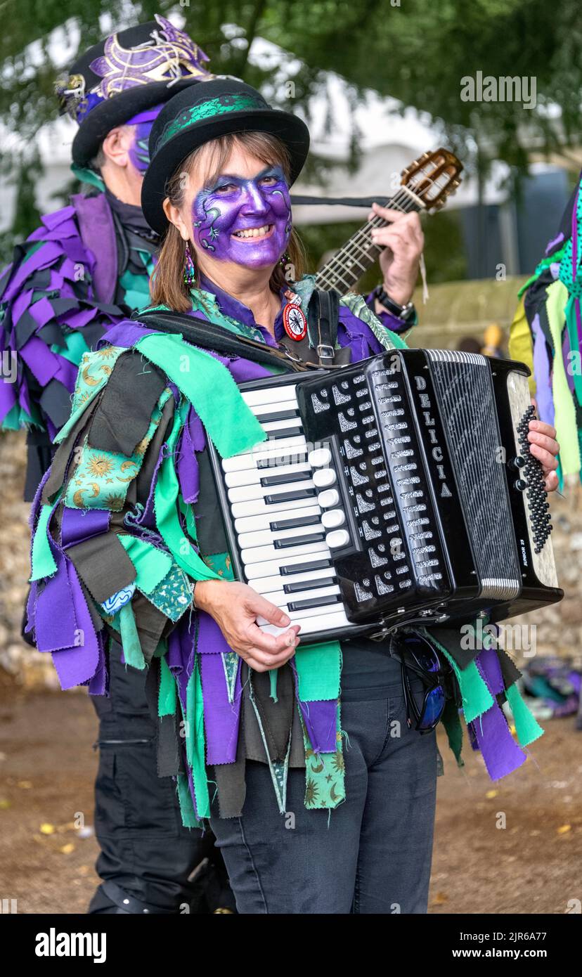 Female Morris Dancer playing Accordion, Flamstead Scarecrow Festival 2022, Flamstead, Hertfordshire Stock Photo