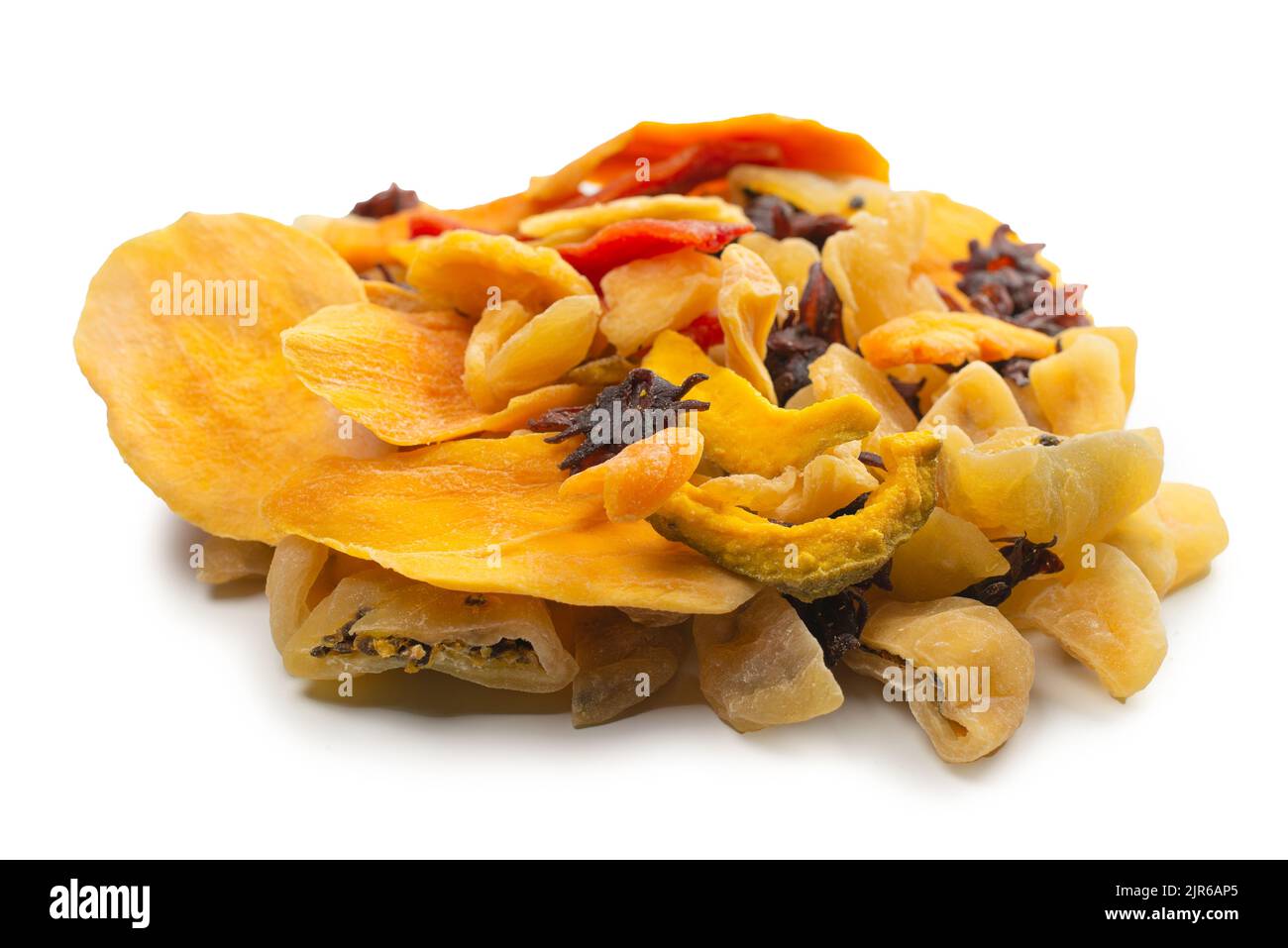 Mix of dried exotic fruit, mangos,slices of pineapples, passion fruit, papaya. Vegetarian dessert. Stock Photo