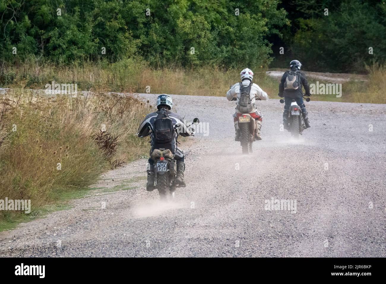 A Group Of Three Motor Cyclists bikers Riding Their Off road a-group-of-three-motor-cyclists-bikers-riding-their-off-road
