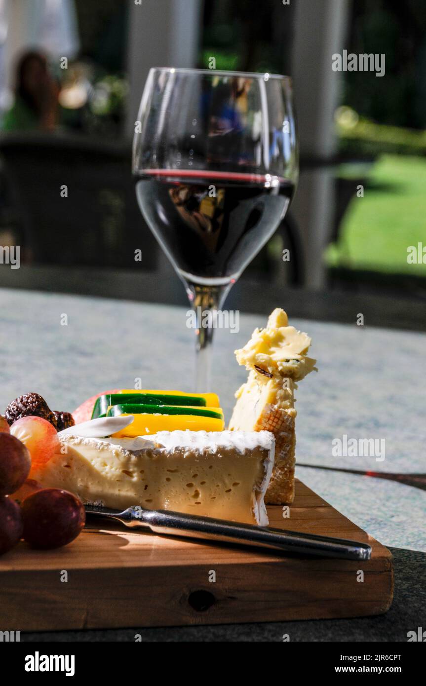 A glass of The Mission’s own Kapiti Port wine with a cheese platter of vintage
