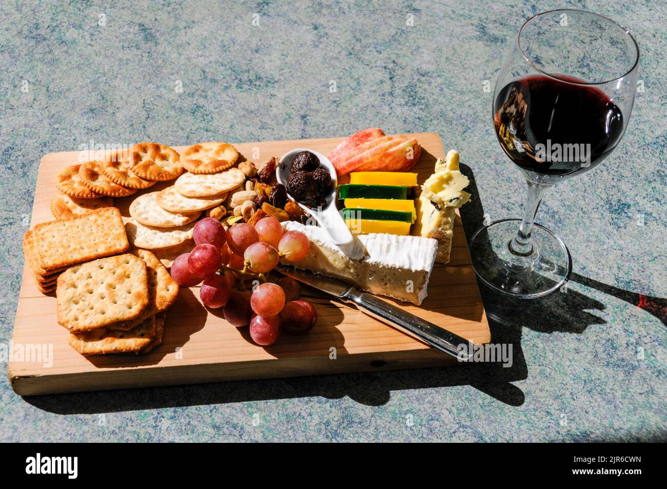 A glass of The Mission’s own Kapiti Port wine with a cheese