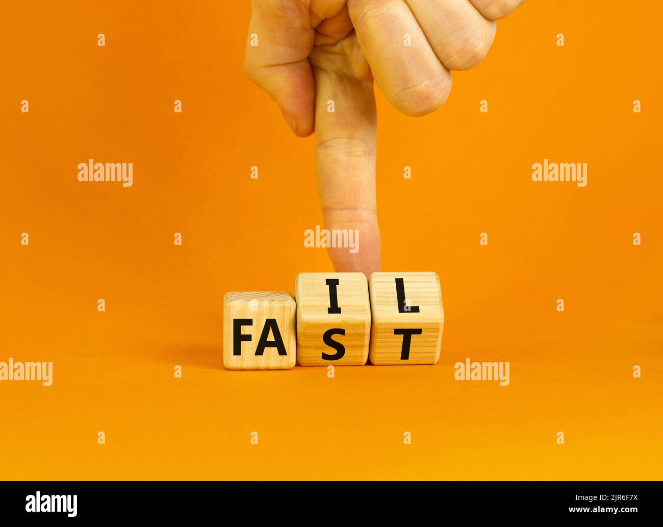 Fail fast symbol concept words fail fast on wooden cubes businessman